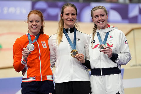 Paris Olympics Track Cycling women's keirin: Ellesse Andrews of New Zealand, centre, (gold), with Hetty van De Wouw of Netherlands (silver), left, and Emma Finucane of Britain (bronze)